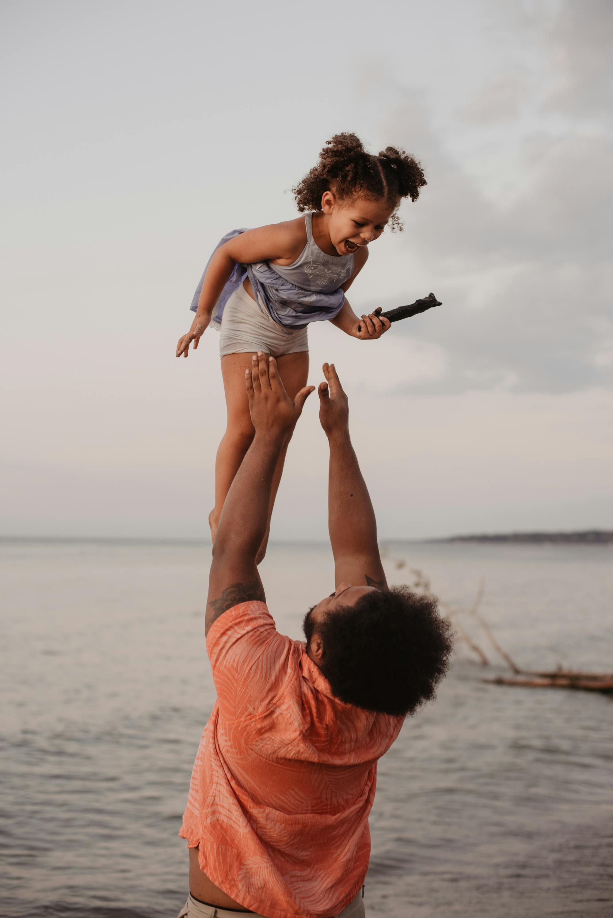 father-and-child-having-fun-on-the-beach