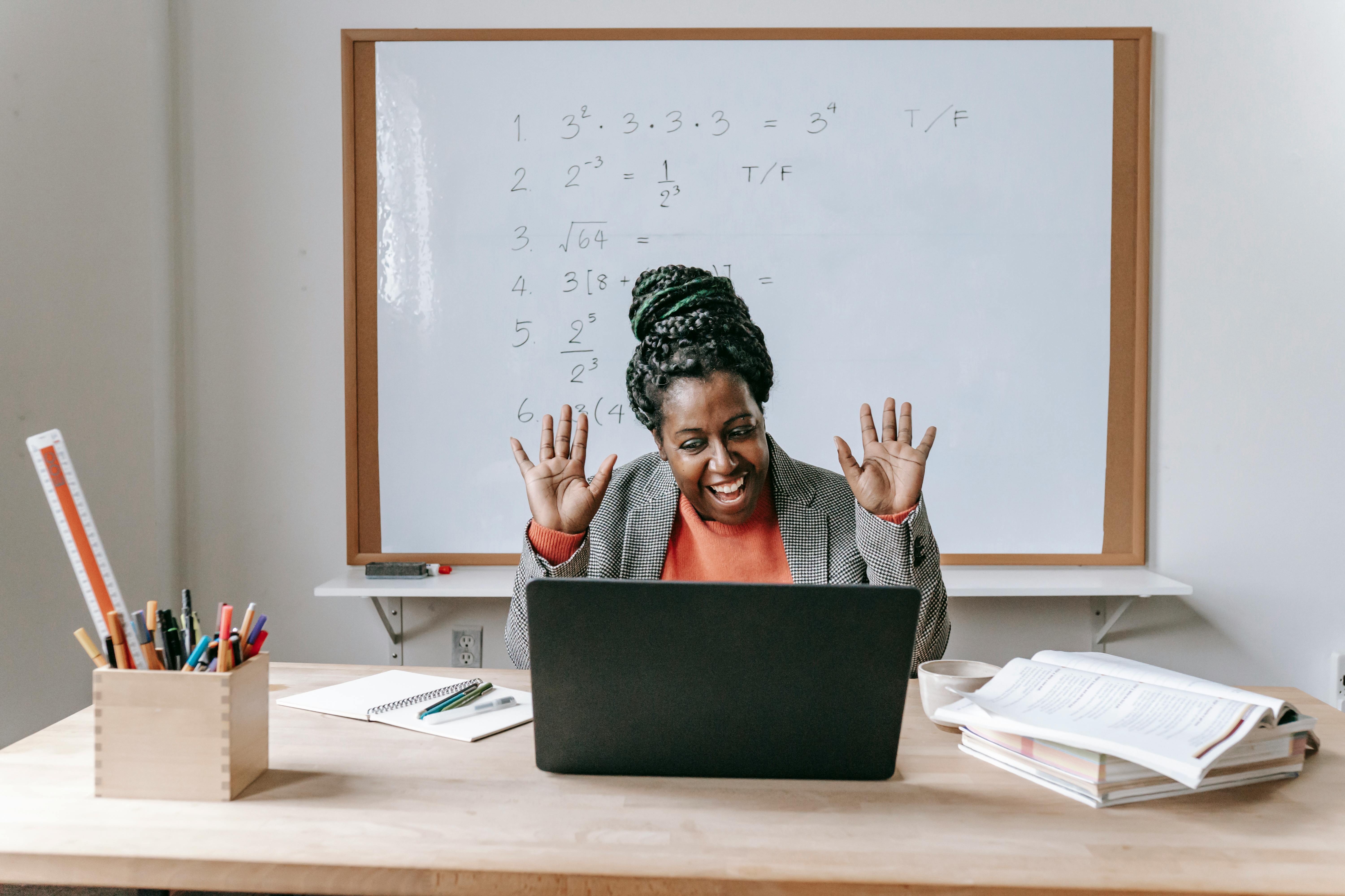https://www.pexels.com/photo/happy-black-woman-using-laptop-for-online-work-5905713/